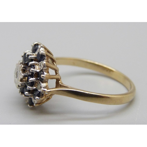 932 - A 9ct gold, diamond and sapphire cluster ring, maker BMJ, 3.4g, Q/R, one diamond missing