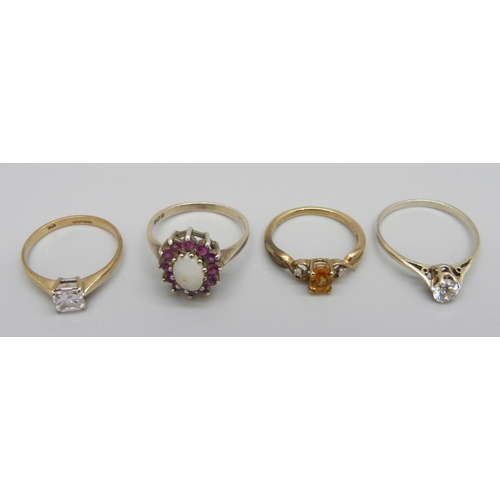 939 - Two 9ct gold rings, 3.2g, and two silver rings, (silver solitaire ring stone loose)