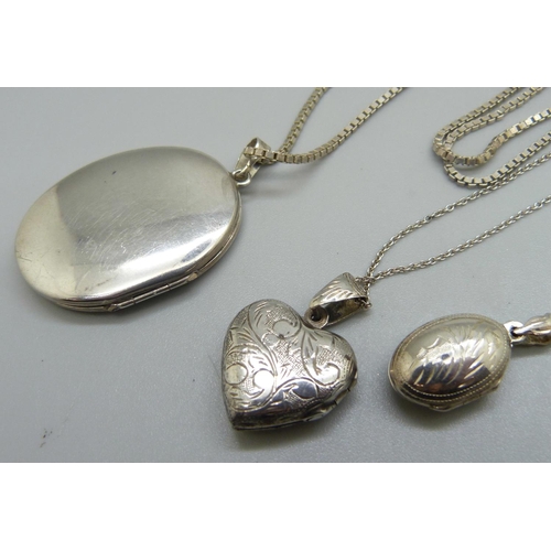 947 - Three silver lockets and chains