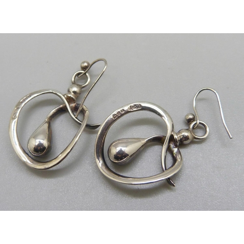 952 - A pair of earrings made from two silver hat-pin tops by Charles Horner