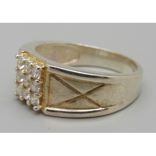 953 - A silver gilt ring, W, set with nine white stones