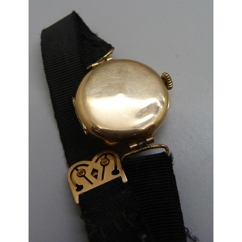 962 - A lady's 9ct gold wristwatch, cased