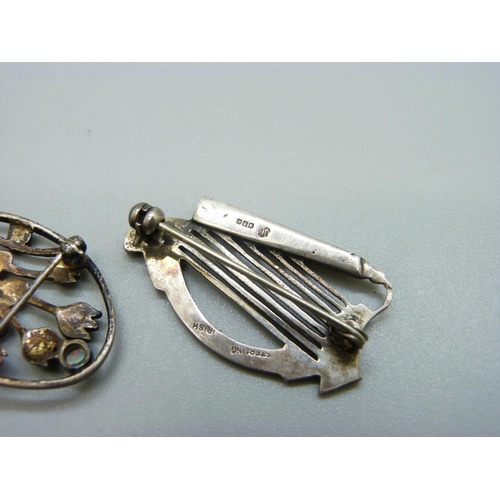 981 - A hallmarked silver harp brooch, four other brooches, two silver rings, etc.