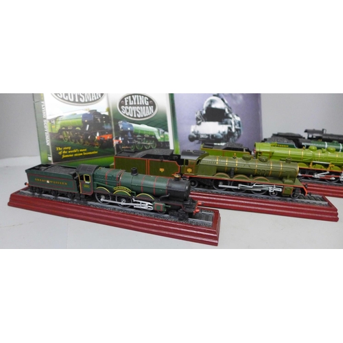 998 - Six models of steam locomotives on wooden plinths and a Flying Scotsman DVD and book set