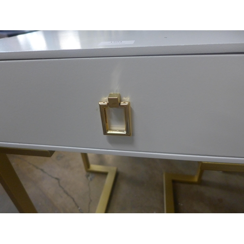 1501 - A white bedside table on gold legs