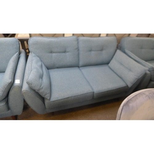 1548 - A DFS French Connection three seater, two seater and love seat in blue textured weave fabric with da... 