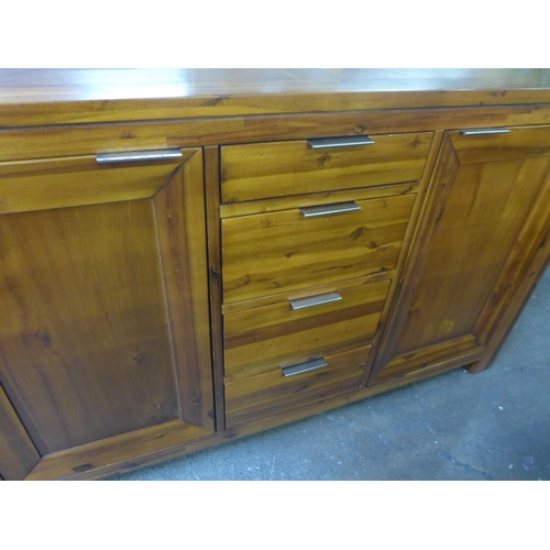 1554 - An Acacia two door, three drawer sideboard