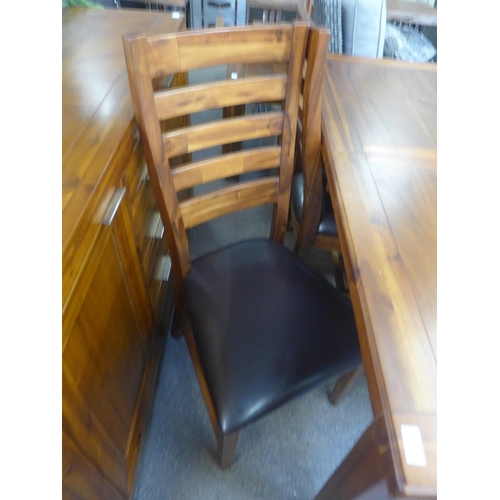 1560 - An Acacia dining table and four chairs