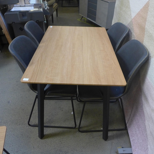 1602 - A Lutina dining table and four Callum dark grey dining chairs