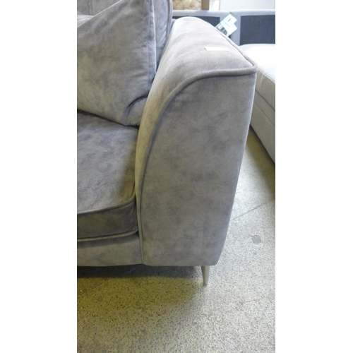 1625 - A grey velvet shark skin effect pinched back three seater sofa on chrome legs