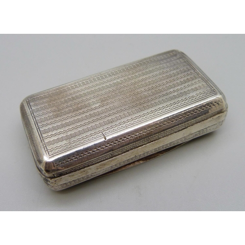 858 - A white metal snuff box, the top with bird detail, with diamond shaped control mark, 58mm wide