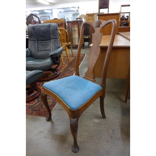 135 - A set of four Queen Anne style oak dining chairs