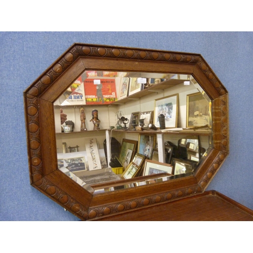 356 - A carved oak octagonal mirror