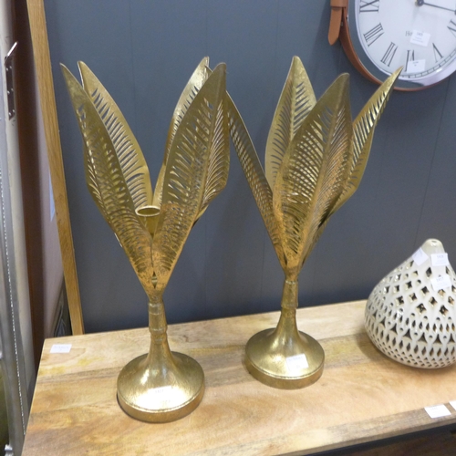 1340 - A pair of gold palm candlesticks