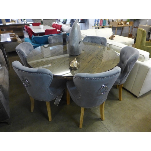 1349 - A Chennai large circular dining table and a set of six Arlo grey chairs