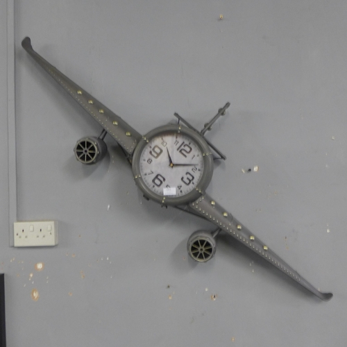 1426 - An aeroplane style wall clock with a wing span of 143cms (PHLL31049)   #