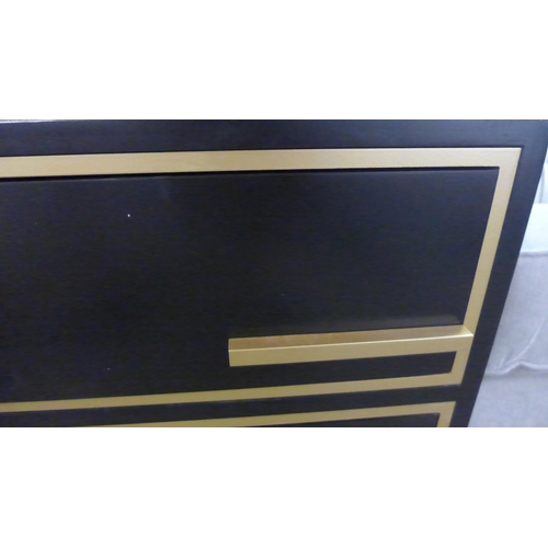 1439 - A black two drawer bedside chest with gold legs