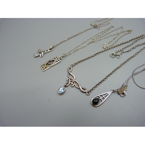 1014 - Four Art Nouveau style pendants and chains