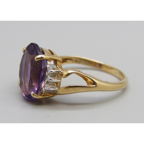 1037 - A 9ct gold, purple stone and diamond ring, 3.1g, L