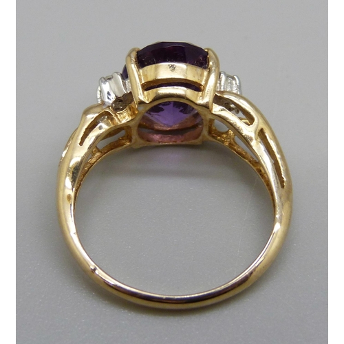 1037 - A 9ct gold, purple stone and diamond ring, 3.1g, L