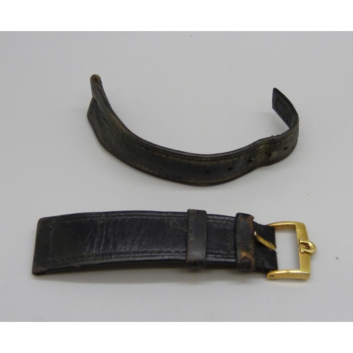 1042 - An Omega wristwatch buckle on a leather strap, 16mm