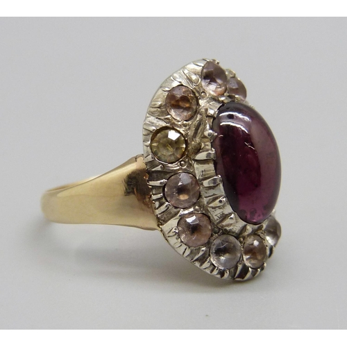 1043 - A late Georgian/early Victorian paste and cabochon garnet cluster ring, gold shank, silver settings,... 