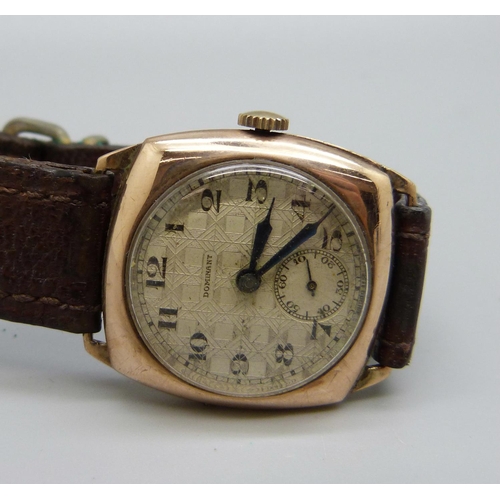 1058 - A 9ct gold cased Dominant wristwatch, 27mm case