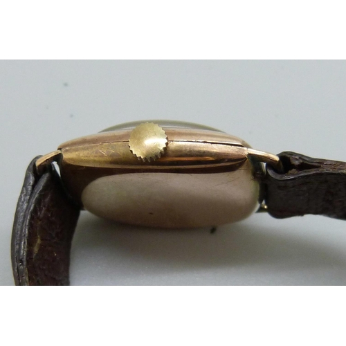 1058 - A 9ct gold cased Dominant wristwatch, 27mm case