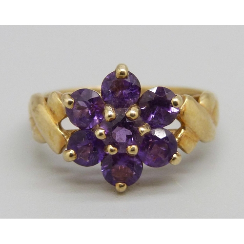 1059 - A 9ct gold and purple stone ring, 2.4g, M