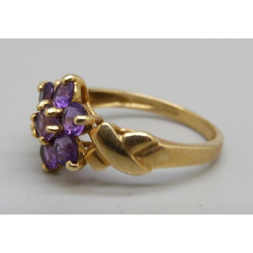 1059 - A 9ct gold and purple stone ring, 2.4g, M