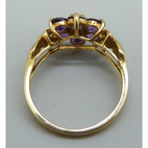 1059 - A 9ct gold and purple stone ring, 2.4g, M