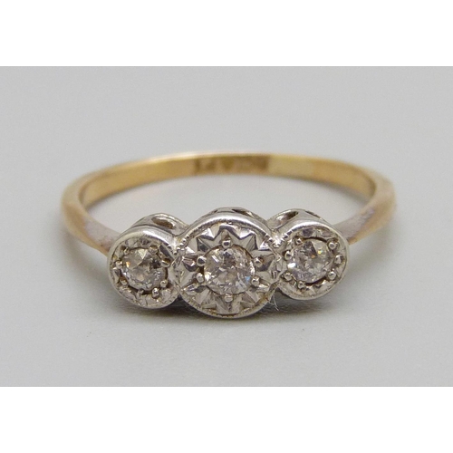 1060 - An 18ct gold, platinum set three stone diamond ring, 2.4g, L