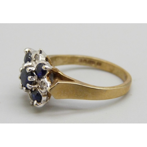 1066 - A 9ct gold, diamond and sapphire ring, 2.6g, G/H