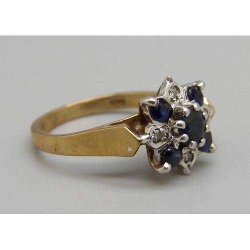 1066 - A 9ct gold, diamond and sapphire ring, 2.6g, G/H