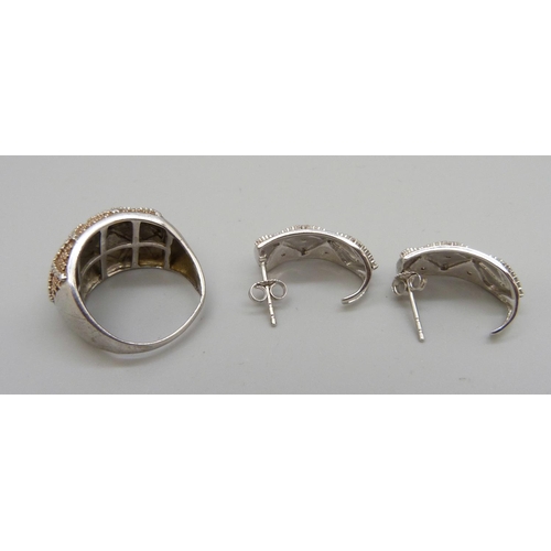 1075 - A silver ring and matching earrings set with small diamonds, ring size O, (shank slightly out of sha... 