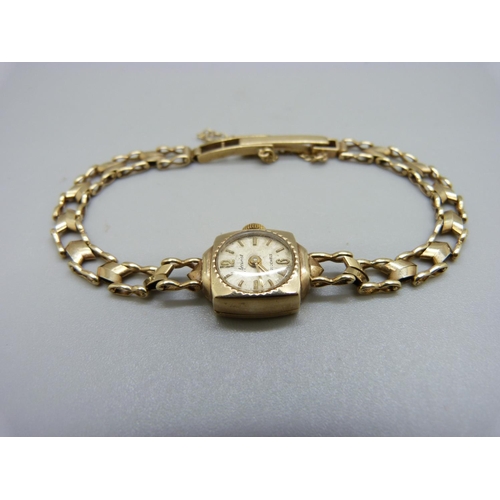 1076 - A lady’s 9ct gold wristwatch, total weight 11.2g