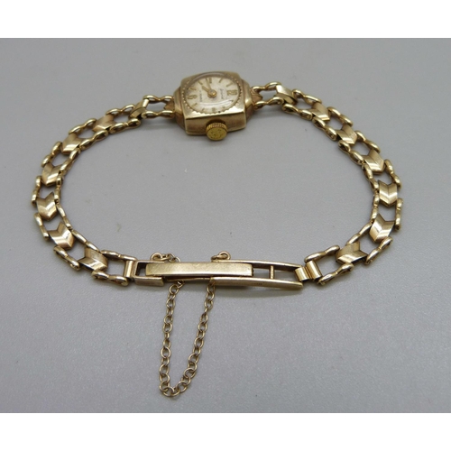 1076 - A lady’s 9ct gold wristwatch, total weight 11.2g