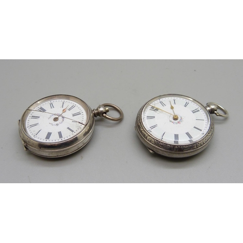 1087 - Two 800 silver fob watches, one glass cracked