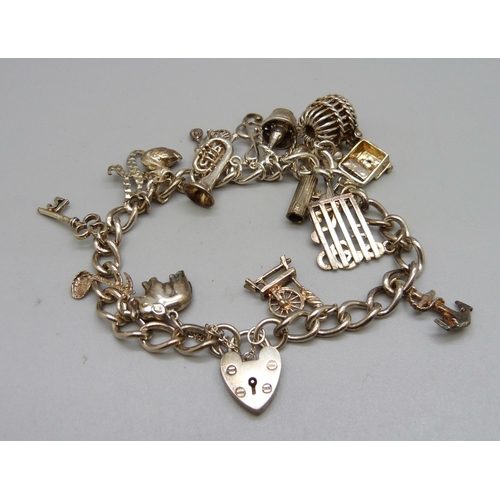 1088 - A silver charm bracelet, 39g