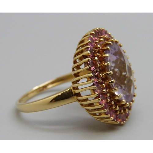 1090 - An 18ct gold, amethyst and pink tourmaline dress ring, 5g, N