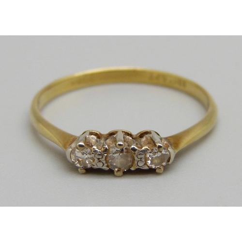 1094 - An 18ct gold, platinum set three stone diamond ring, 1.7g, P