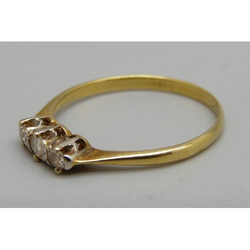 1094 - An 18ct gold, platinum set three stone diamond ring, 1.7g, P