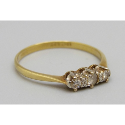 1094 - An 18ct gold, platinum set three stone diamond ring, 1.7g, P