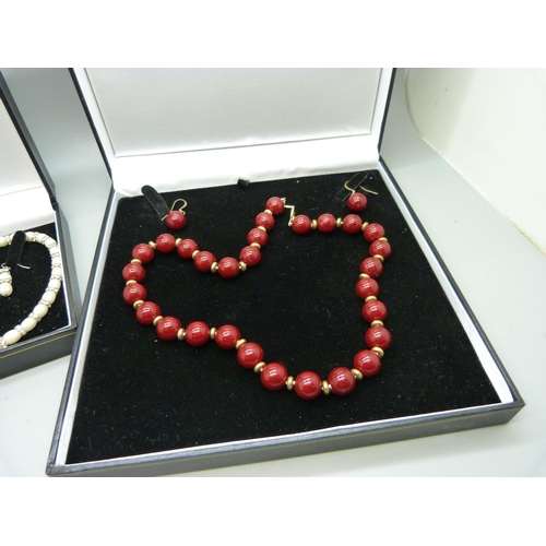 1095 - Two 'The Pearl Company' pearl necklace with matching earring sets, boxed