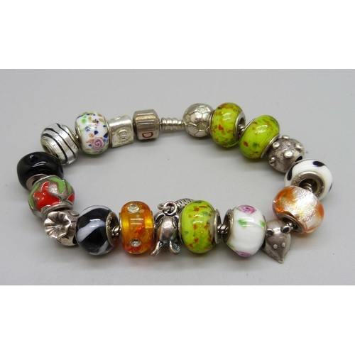 1096 - A 'Devil' silver bracelet with charms including Rhona Sutton