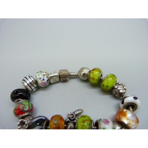 1096 - A 'Devil' silver bracelet with charms including Rhona Sutton