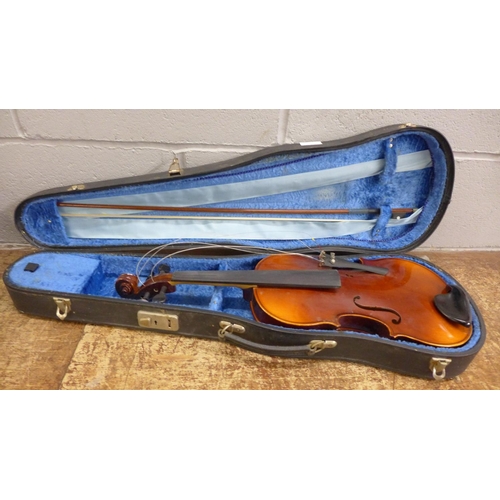 1110 - A violin with paper label marked Stradivarius model by Rosetti, cased