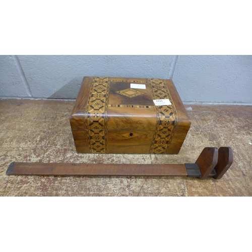 1111 - An inlaid sewing box and a wooden measure