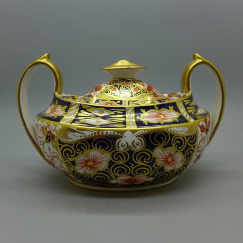 621 - A Royal Crown Derby 2451 pattern two handled pot with lid, 13.5cm wide with handles