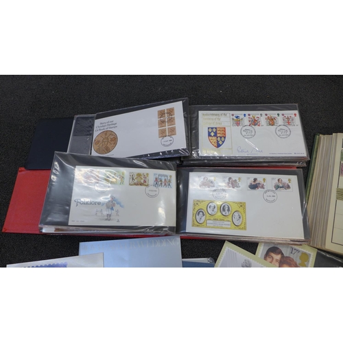 662 - Two folders of first day covers, a stamp album and other stamps